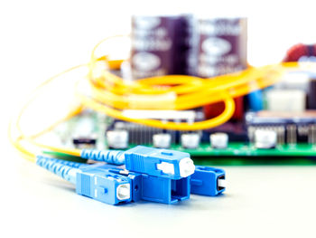 Close-up of electrical components over white background