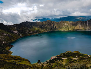 Scenic view of lake against cloudy sky