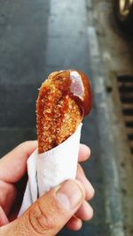 Close-up of hand holding ice cream