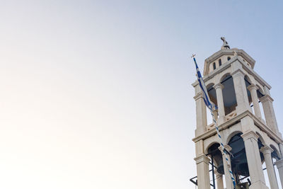 Low angle view of church and building against clear sky