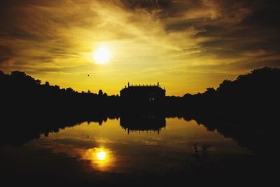 Scenic view of lake against sky during sunset