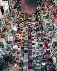 Low angle view of buildings in city at night