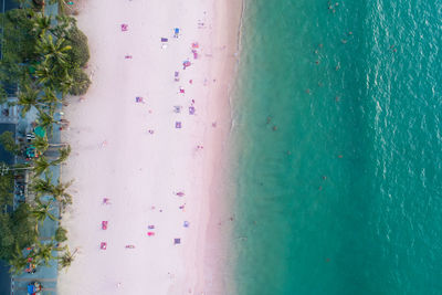Aerial view top down of pink sandy beach beautiful pastel sand beach phuket thailand amazing sea