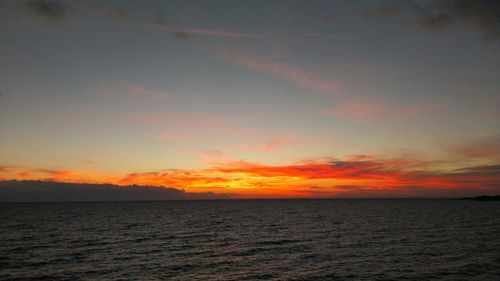 Scenic view of sea at sunset