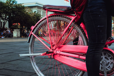 Red bicycle on street in city