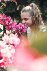 Girl smelling flowers