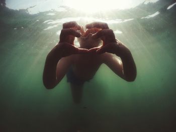 Young woman swimming in sea