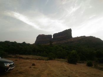 View of landscape against cloudy sky