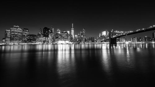 Illuminated city at waterfront