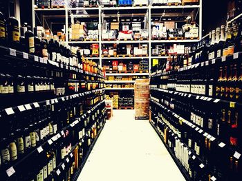 Full frame shot of wine bottles in rack