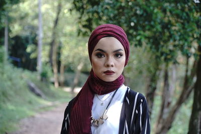 Woman standing in forest