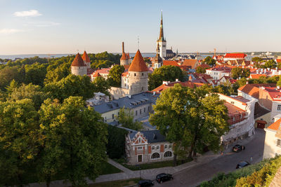 Buildings in town against sky