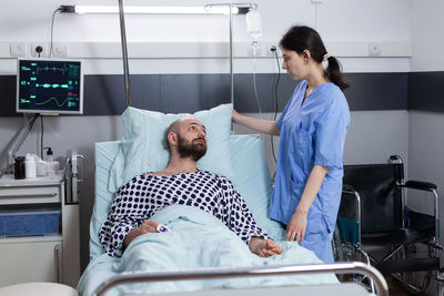 Nurse talking to patient at hospital