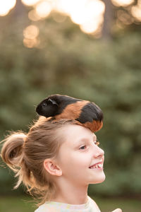 Side view of young woman looking away