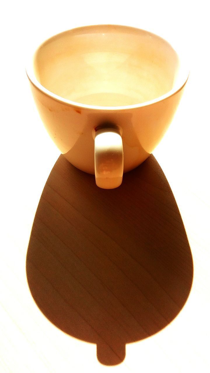 CLOSE-UP OF COFFEE ON TABLE