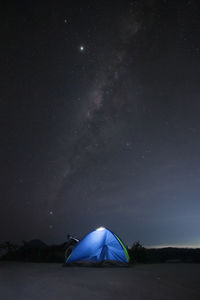 Scenic view of tent against sky at night