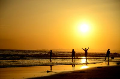 Silhouette of people at beach
