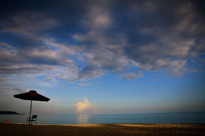 Scenic view of beach against sky during sunset