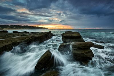 Scenic view of sea against cloudy sky