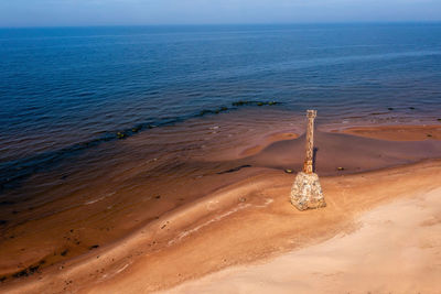 Old ruins of kurmrags lighthouse on the shore of the rigas gulf, baltic sea, latvia, aerial view