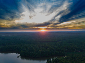 Scenic view of landscape against sky during sunset