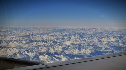 Aerial view of landscape against cloudy sky