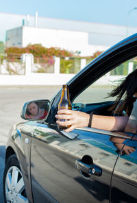 Portrait of man sitting in car