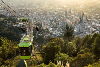 High angle view of trees and buildings in city