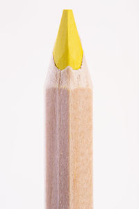 Close-up of yellow cake against white background