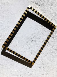 High angle view of piano keys on wall