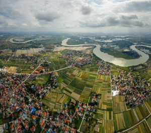 High angle view of crowd on landscape against sky