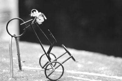 Close-up of bicycle on metal table