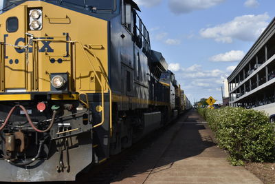 Train on railroad track against sky