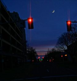 Low angle view of illuminated buildings against sky at dusk