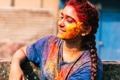 Close-up of woman covered with powder paint