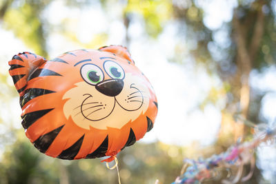 Close-up of stuffed toy hanging on tree