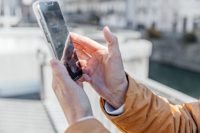 A business person with a smartphone in the city. business vision, communications, online shopping.