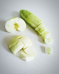 High angle view of chopped slices over white background