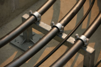 High angle view of metal railing against wall