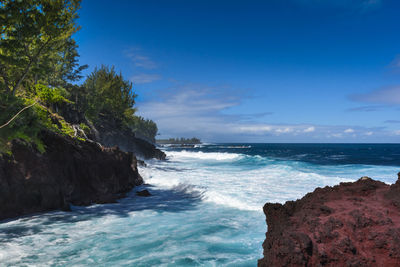 Scenic view of sea against blue sky
