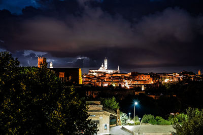 High angle view of buildings against sky at night