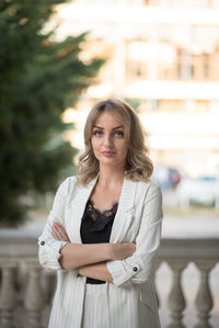 Portrait of a young woman standing outdoors