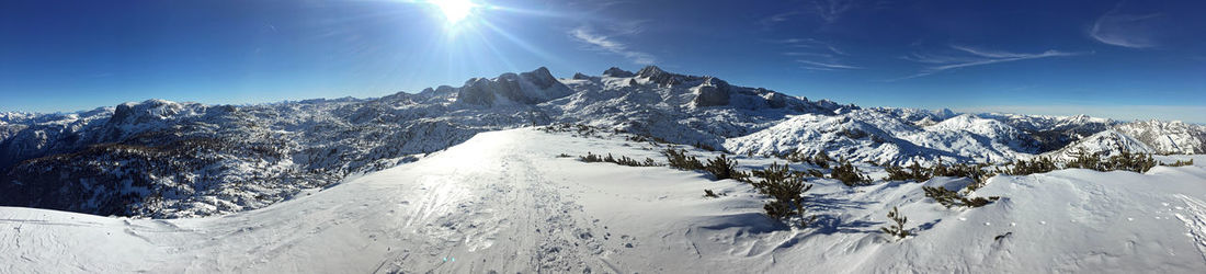 Scenic view of snowcapped mountains against sky