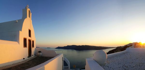 Scenic view of sea against clear sky during sunset