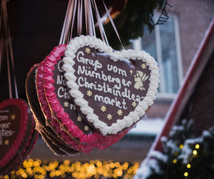 Close-up of text on heart shape food for sale in market