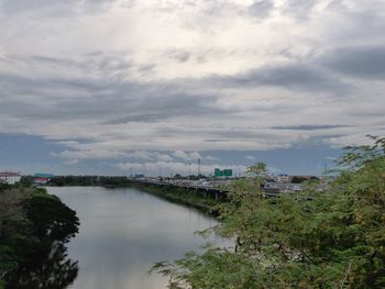 High angle view of buildings and trees against sky
