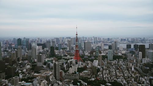 Aerial view of modern buildings in city against sky