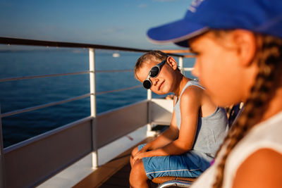 Young woman sitting on boat