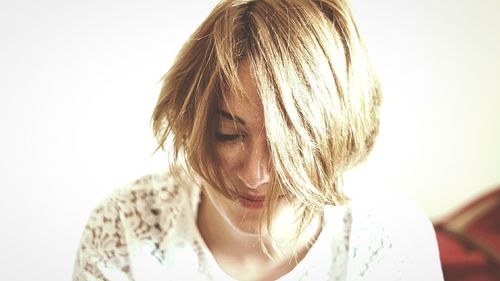 Close-up of woman over white background