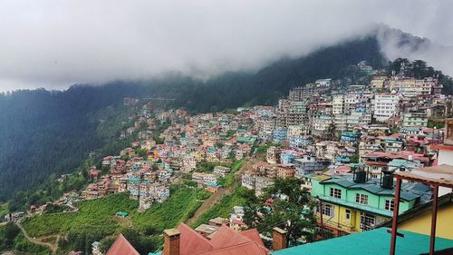 Aerial view of town against sky